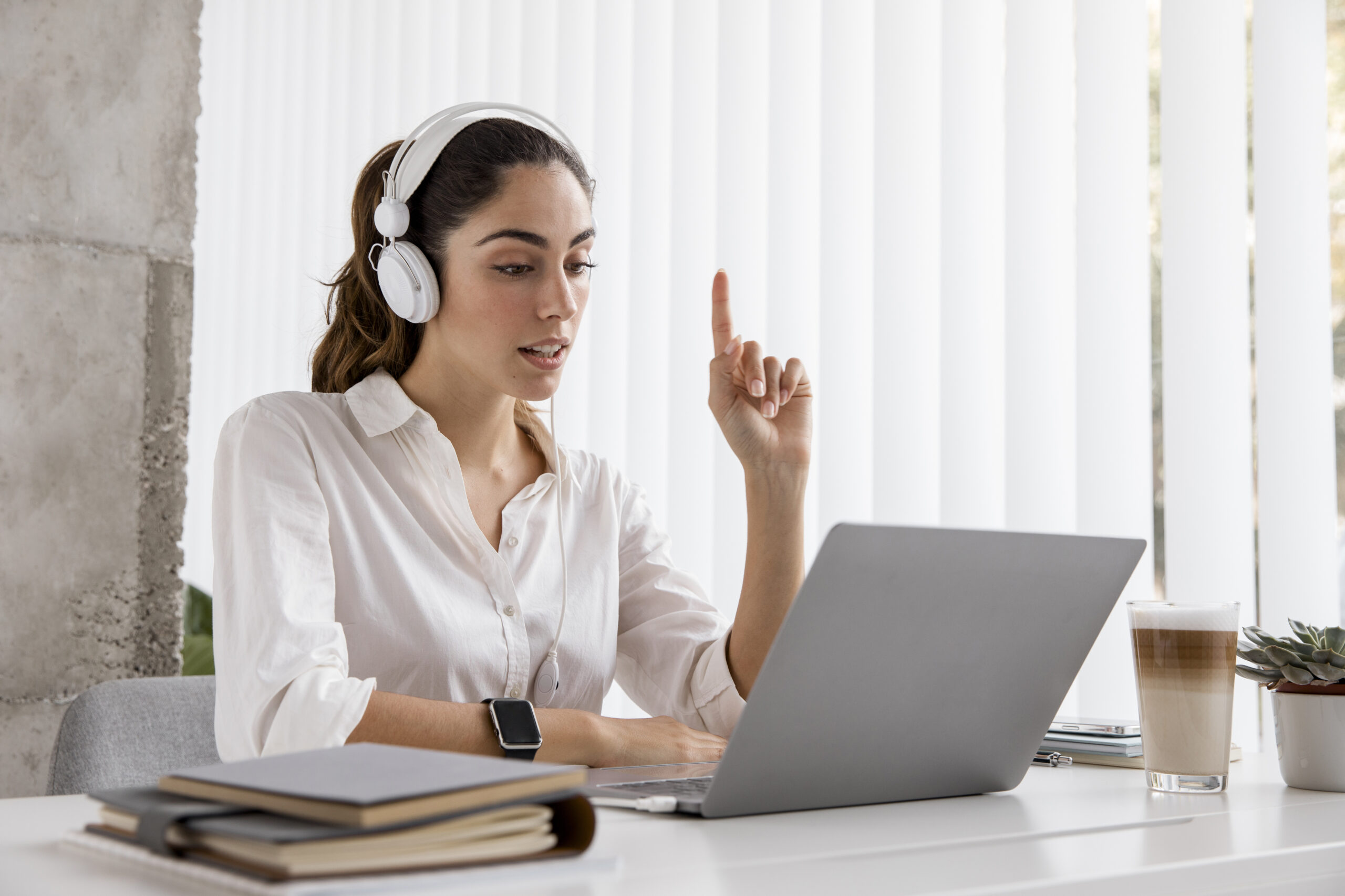 side-view-businesswoman-working-with-headphones-laptop